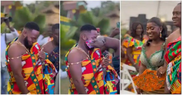 Handsome Groom In Rich Kente Almost Cries After Seeing Bride Photo Source: wedwithkingmcb on TikTok