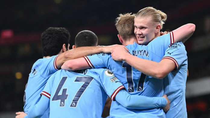 Manchester City's Norwegian striker Erling Haaland (R) celebrates with teammates after scoring his team third goal during the English Premier League football match between Arsenal and Manchester City at the Emirates Stadium in London on February 15, 2023 Image credit: Getty Images