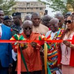 Akuf-Addo flanked by Adwoa Safo and Education Minister as he cuts tape for model school