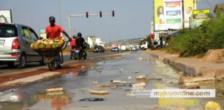 An overflow of toxic waste water on a portion of Mallam Junction Kasoa road at SCC Junction