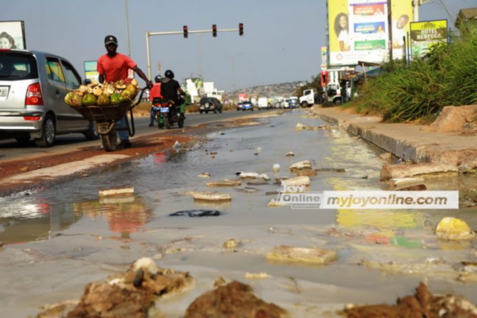 An overflow of toxic waste water on a portion of Mallam Junction Kasoa road at SCC Junction