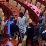 Former Minority leader, Haruna Iddrisu (in brown Khaftan) interacting with colleagues