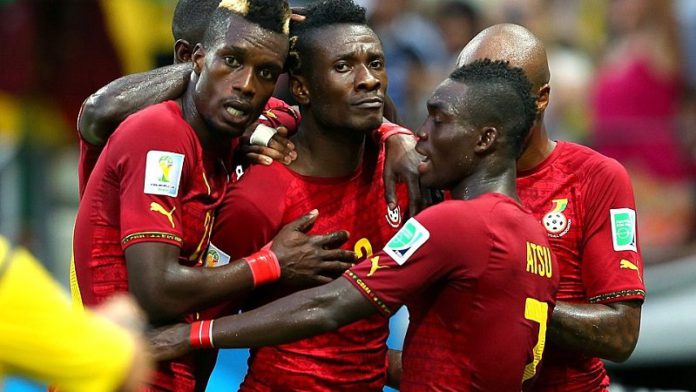 Asamoah Gyan celebrates with Christian Atsu