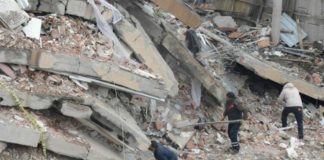 Rescue workers and volunteers conduct search and rescue operations in the rubble of a collasped building, in Diyarbakir on February 6, 2023, after a 7.8-magnitude earthquake struck the country's south-east. - The combined death toll has risen to over 1,900 for Turkey and Syria after the region's strongest quake in nearly a century. Turkey's emergency services said at least 1,121 people died in the earthquake, with another 783 confirmed fatalities in Syria. (Photo by ILYAS AKENGIN / AFP) (Photo by ILYAS AKENGIN/AFP via Getty Images)