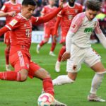 Bayern beat Augsburg to go clear of Dortmund at top Joao Cancelo scored the first goal of his loan spell at Bayern Munich from Manchester City