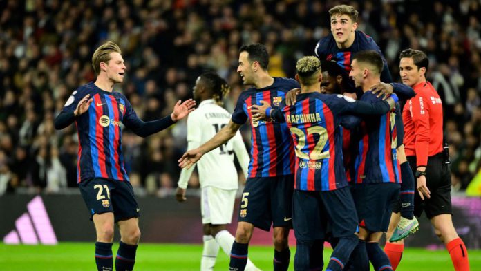 Barcelona's Ivorian midfielder Franck Kessie (C) celebrates with teammates after scoring his team's first goal during the Copa del Rey (King's Cup) semi final first leg football match between Real Madrid CF and FC Barcelona at the Santiago Bernabeu stadiu Image credit: Getty Images