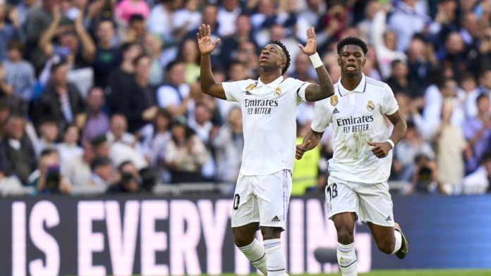 Vinicius Junior of Real Madrid CF celebrates after scoring his team's first goal during the LaLiga Santander match between Real Madrid CF and RCD Espanyol at Estadio Santiago Bernabeu on March 11, 2023 in Madrid, Spain. Image credit: Getty Images