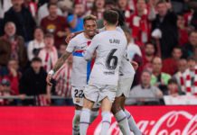 Raphinha of FC Barcelona celebrates with teammates after scoring the team's first goal during the LaLiga Santander match between Athletic Club and FC Barcelona at San Mames Stadium Image credit: Getty Images