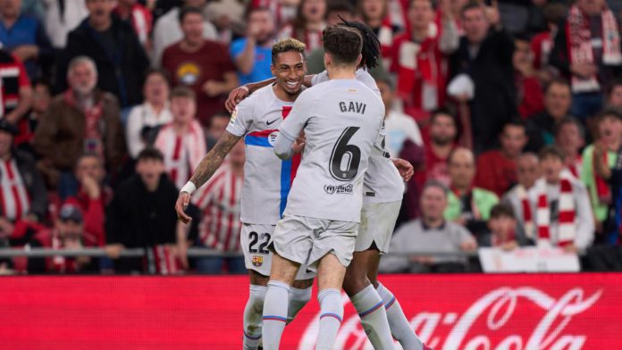 Raphinha of FC Barcelona celebrates with teammates after scoring the team's first goal during the LaLiga Santander match between Athletic Club and FC Barcelona at San Mames Stadium Image credit: Getty Images