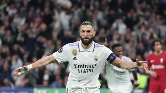 Real Madrid's French forward Karim Benzema celebrates scoring his team's first goal during the UEFA Champions League last 16 second leg football match between Real Madrid CF and Liverpool FC at the Santiago Bernabeu stadium in Madrid on March 15, 2023. (P Image credit: Getty Images