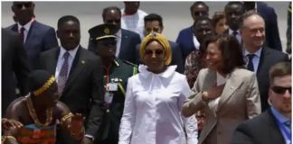 Shirley Ayorkor Botchwey in a white shirt, and Vice President Kamala Harris stuns in corporate wear. Source: @apnews