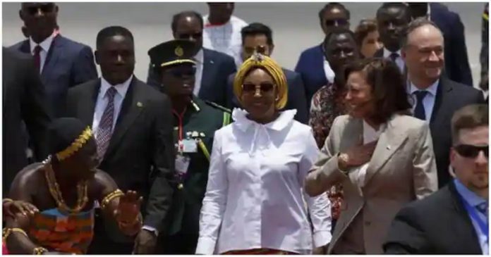 Shirley Ayorkor Botchwey in a white shirt, and Vice President Kamala Harris stuns in corporate wear. Source: @apnews