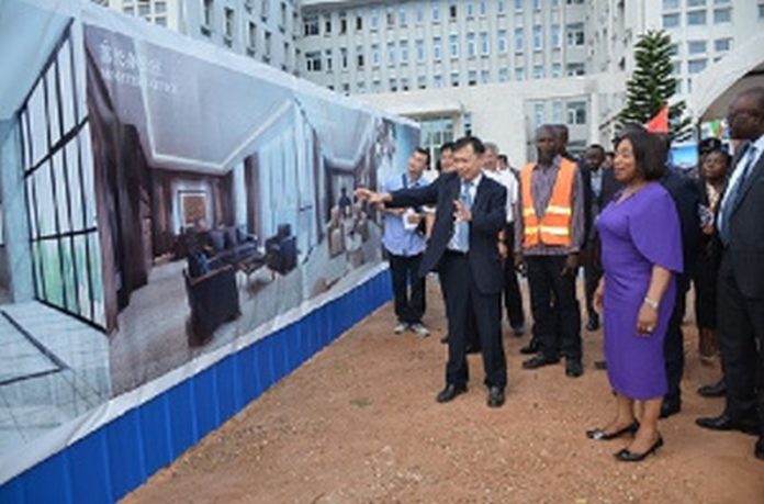 Ambassador Lu Kun showing Ms Shirley Ayorkor Botchwey and others round the proposed annex