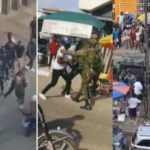 Armed police officers and soldiers clash
