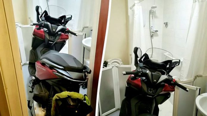 Police discovered a stolen motorbike parked in the bathroom of a residential property (Image: Dudley Police / SWNS)