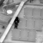 The trickster appeared to be laying against a solar panel on the roof of a building in Wandsworth, London, but they were spotted by police circling above in a helicopter (Image: @NPASLondon/Twitter)