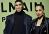 Moroccan and PSG defender Achraf Hakimi (L) and Spanish actress Hiba Abouk pose for a photocall prior to the Balmain Fall-Winter 2022-2023 collection fashion show during the Paris Womenswear Fashion Week, in Paris, on March 2, 2022. (AFP)