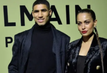 Moroccan and PSG defender Achraf Hakimi (L) and Spanish actress Hiba Abouk pose for a photocall prior to the Balmain Fall-Winter 2022-2023 collection fashion show during the Paris Womenswear Fashion Week, in Paris, on March 2, 2022. (AFP)