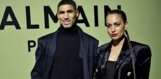 Moroccan and PSG defender Achraf Hakimi (L) and Spanish actress Hiba Abouk pose for a photocall prior to the Balmain Fall-Winter 2022-2023 collection fashion show during the Paris Womenswear Fashion Week, in Paris, on March 2, 2022. (AFP)