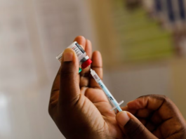A nurse fills a syringe with malaria vaccine before administering it to an infant at the Lumumba Sub-County hospital in Kisumu, Kenya, July 1, 2022. REUTERS/Baz Ratner