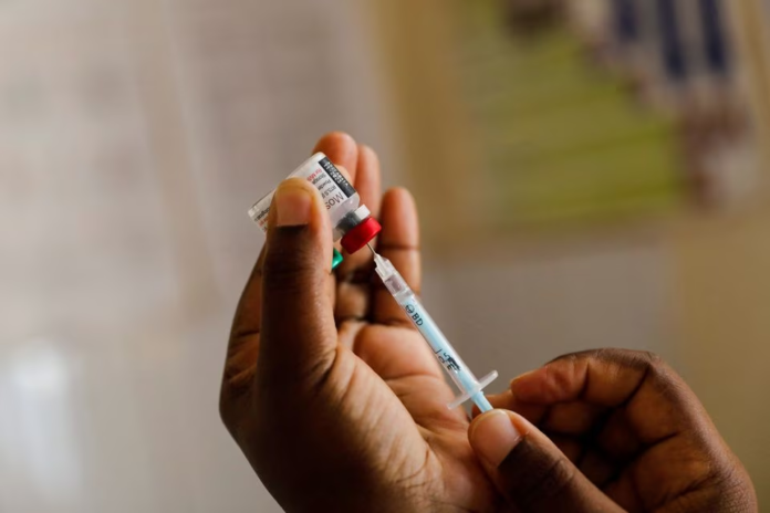 A nurse fills a syringe with malaria vaccine before administering it to an infant at the Lumumba Sub-County hospital in Kisumu, Kenya, July 1, 2022. REUTERS/Baz Ratner