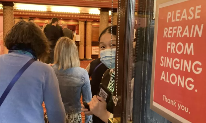 Signs at Manchester's Palace theatre ask audience members not to sing along during The Bodyguard