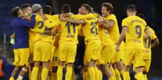 Barcelona's players celebrated on the pitch after claiming their 27th La Liga championship