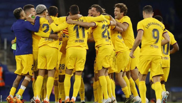 Barcelona's players celebrated on the pitch after claiming their 27th La Liga championship