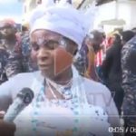 The priestess narrating the incident to a journalist