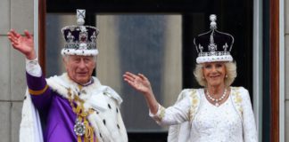 Britain's King Charles and Queen Camilla wave on the Buckingham Palace balcony following their coronation ceremony in London, Britain May 6, 2023. REUTERS/Matthew Childs