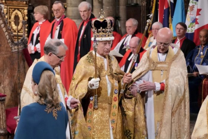 King Charles III is crowned by the archbishop of Canterbury during his coronation ceremony in Westminster Abbey, London [Jonathan Brad via Reuters]