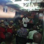 Mr Mettle (Municipal Director), LaDMA, interacting with members of Kone -Adu We Clan to commemorate the Constitution Week Celebration at La