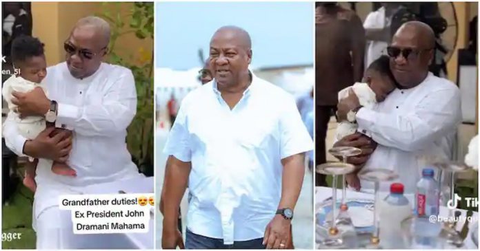 John Mahama holds cute baby Photo Source: ewe_blogger