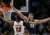 Aaron Gordon tries to block Bam Adebayo's effort