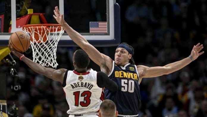 Aaron Gordon tries to block Bam Adebayo's effort