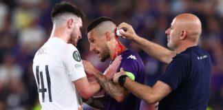 Fiorentina's Cristiano Biraghi needed treatment for a wound to the head after he struck by an object thrown from the stands during Wednesday's Europa Conference League final