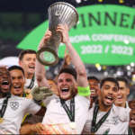 Declan Rice of West Ham United lifts the UEFA Europa Conference League trophy after the team's victory during the UEFA Europa Conference League 2022/23 final match between ACF Fiorentina and West Ham United FC at Eden Arena. Image credit: Getty Images