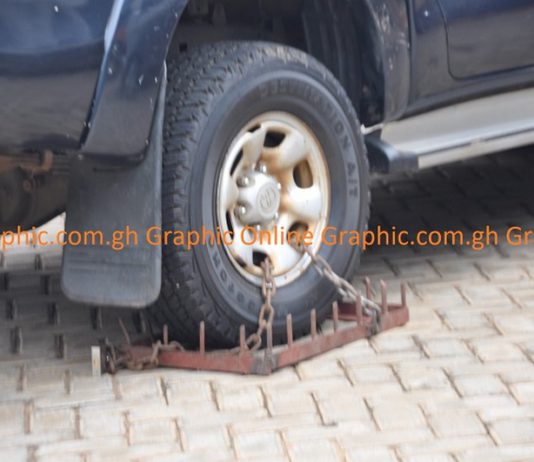 The financial officer’s official vehicle the clamped tyre