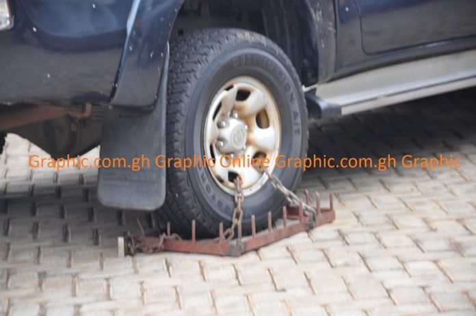 The financial officer’s official vehicle the clamped tyre