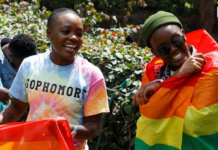 Participants react with Pride rainbow flags as they attend the Badilika festival to celebrate the LGBT rights in Nairobi, Kenya, June 11, 2023. REUTERS/Monicah Mwangi