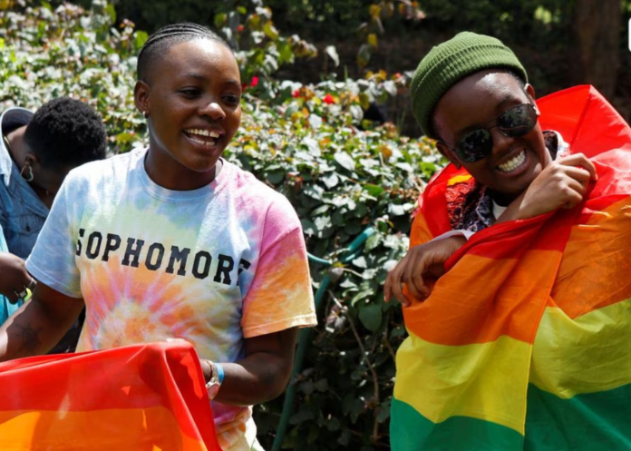 Participants react with Pride rainbow flags as they attend the Badilika festival to celebrate the LGBT rights in Nairobi, Kenya, June 11, 2023. REUTERS/Monicah Mwangi