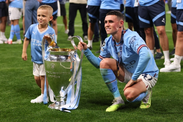 Foden and son Ronnie starred in Man City's treble celebrations Credit: Getty