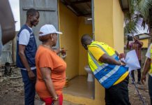 Minister of Sanitation and Water Resources, Cecilia Abena Dapaah, inspecting one of the toilets at Ejisu in the Greater Kumasi Metropolitan Area (GKMA). With him is the National Coordinator of GAMA-SWP, George Asiedu.