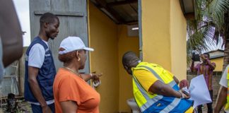Minister of Sanitation and Water Resources, Cecilia Abena Dapaah, inspecting one of the toilets at Ejisu in the Greater Kumasi Metropolitan Area (GKMA). With him is the National Coordinator of GAMA-SWP, George Asiedu.