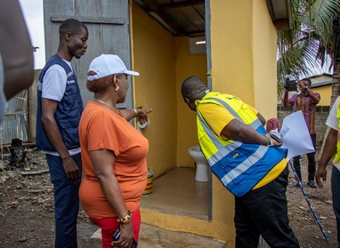 Minister of Sanitation and Water Resources, Cecilia Abena Dapaah, inspecting one of the toilets at Ejisu in the Greater Kumasi Metropolitan Area (GKMA). With him is the National Coordinator of GAMA-SWP, George Asiedu.