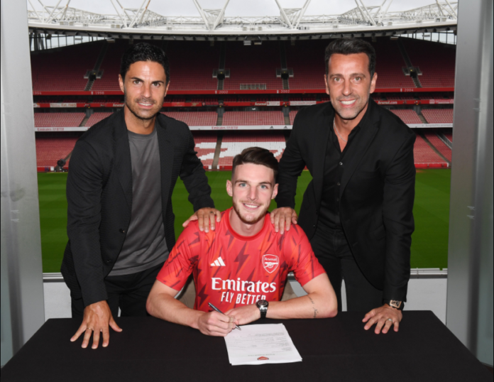 Rice (centre) has become Arsenal's record transfer following his move from West Ham