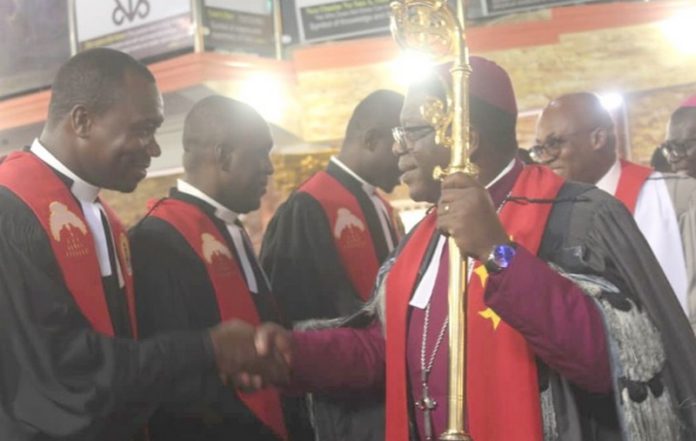 Most Rev. Paul Kwabena Boafo (with a staff in hand), ordaining the priests at the ceremony