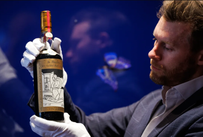 Jonny Fowle, Sotheby's global head of whisky, unveils a bottle of The Macallan 1926, the world's most expensive whisky on October 19, 2023 in London, England. Jonny Fowle, Sotheby's global head of whisky, unveils a bottle of The Macallan 1926, the world's most expensive whisky on October 19, 2023 in London, England.