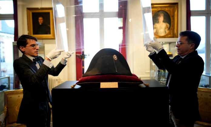 The broad black hat that Napoleon wore when he ruled 19th-century France and waged war in Europe fetched more than $2 million at auction on Sunday. Christophe Ena/AP