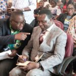 Eric Angel Carbonu (left), President, National Association of Graduate Teachers, conferring with Dr Yaw Osei Adutwum (right), Minister of Education, at the launch. Picture: EDNA SALVO-KOTEY